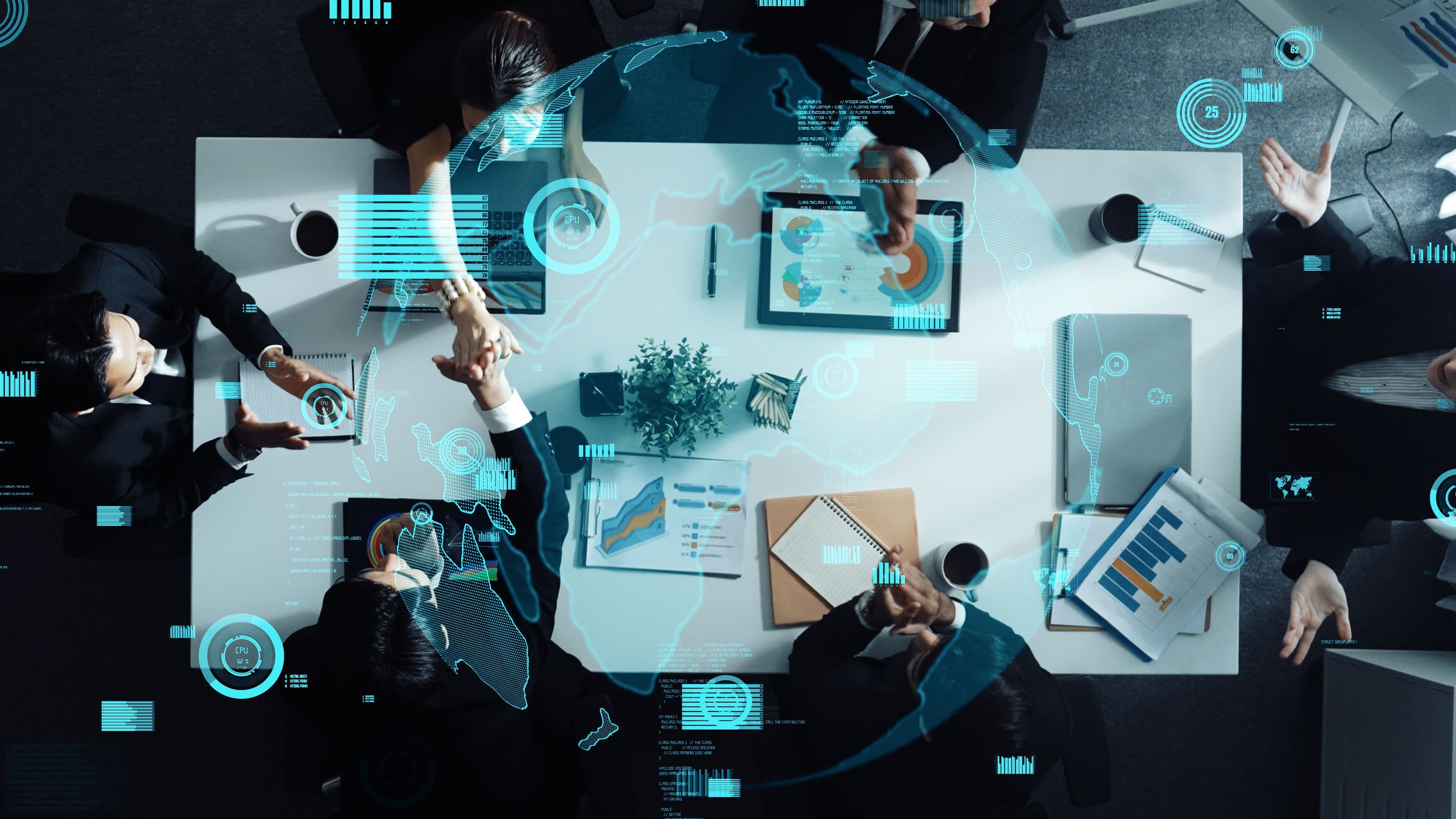 Business team collaborating at a digital-enabled workspace, representing strategy and consulting for digital transformation initiatives.