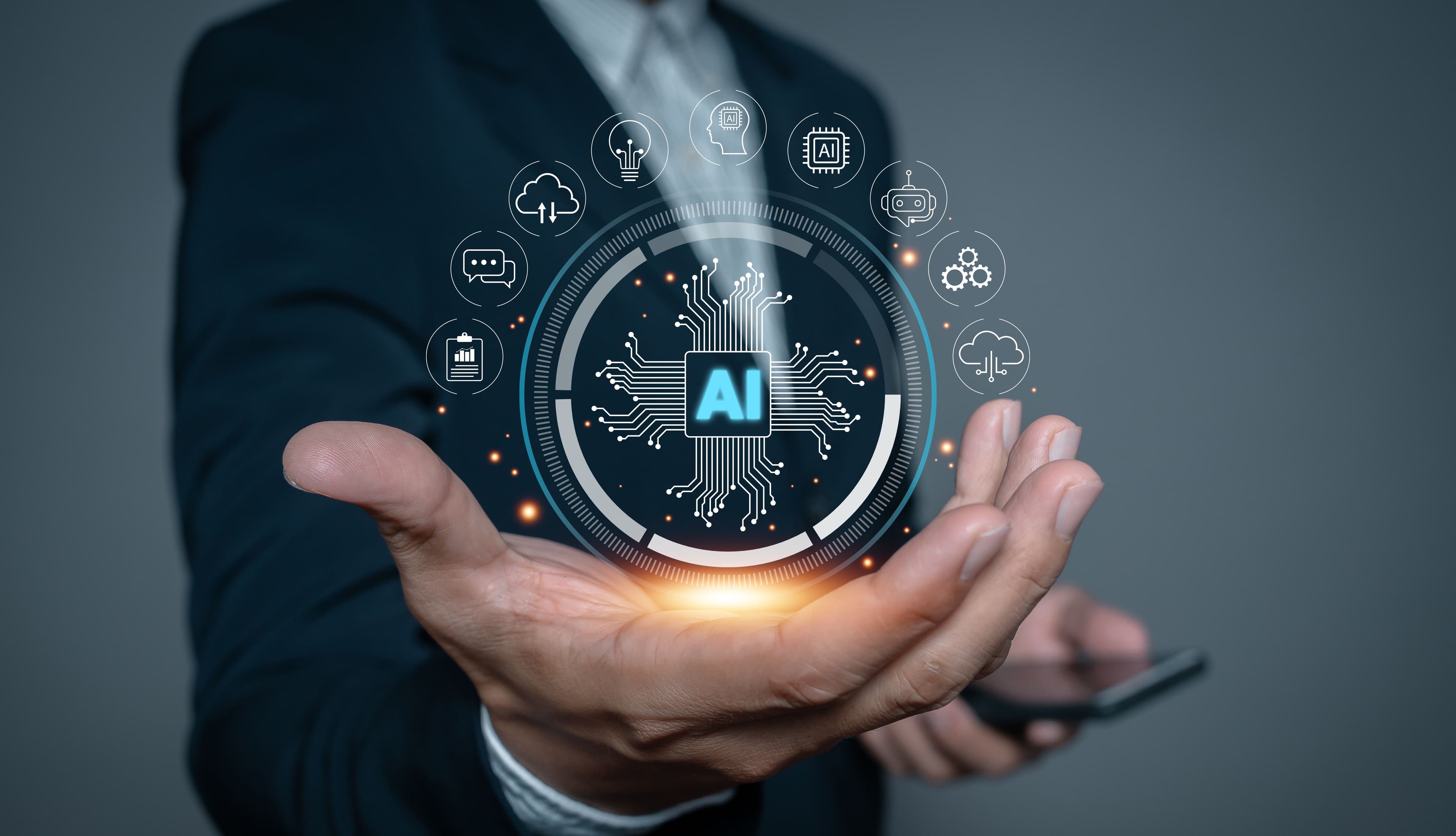 A business professional holding a digital AI interface, symbolizing intelligent automation solutions.